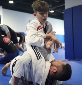 Why adults who practice jiu-jitsu tend to be inspirations for children interested in the sport?